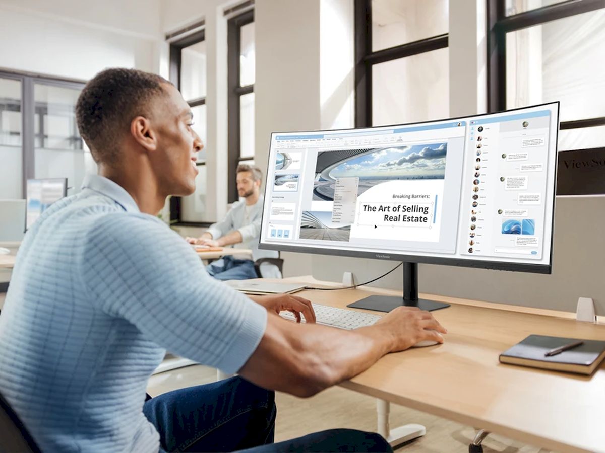 Office environment with a ViewSonic ultrawide monitor supporting efficient workflow and document management.