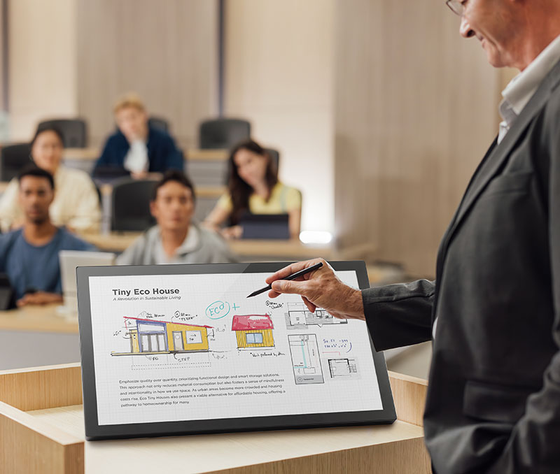 Teacher using an interactive lab station powered by an open frame touchscreen