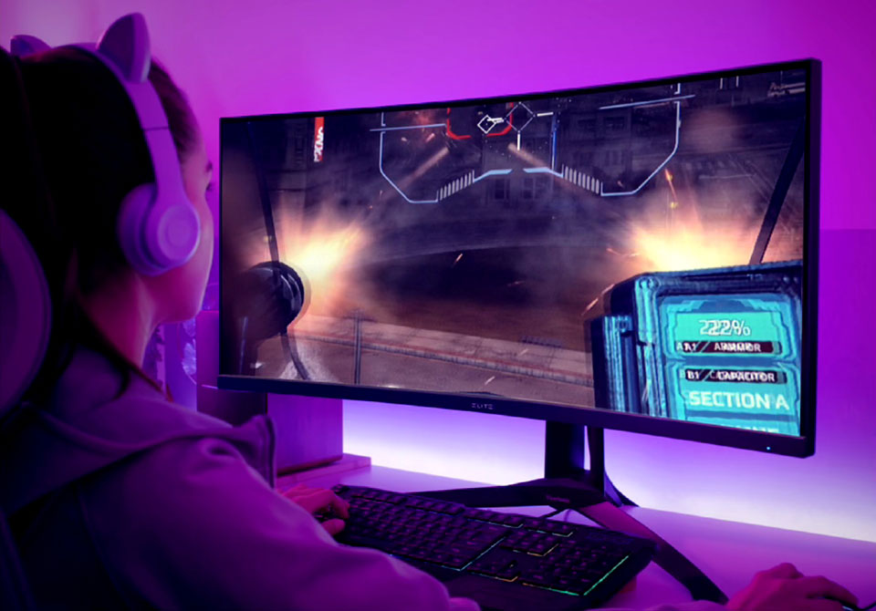 Gamer using an ultrawide monitor for an enhanced field of view.
