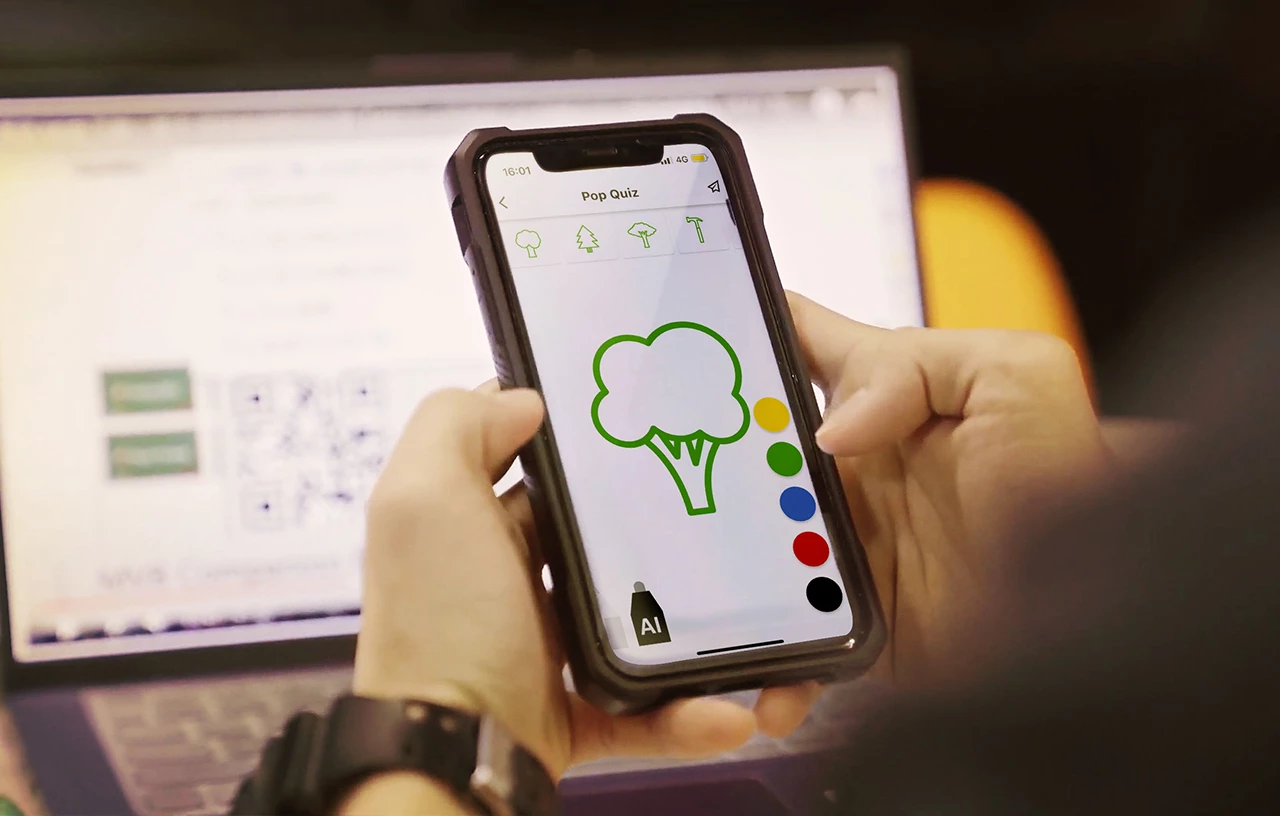 A student using a mobile device as a visual learning assistant.
